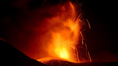 Mount Etna erupts, spewing lava and ash clouds 15,000 feet into the air