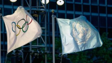 UN-backed refugee athletes honored as Olympic flag bearers