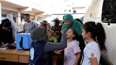 Amid fear and hope, thousands of Gaza parents line up to protect their children from polio