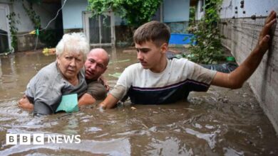 Rush to reinforce flood defences amid deaths and evacuations