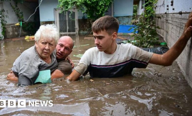 Rush to reinforce flood defences amid deaths and evacuations