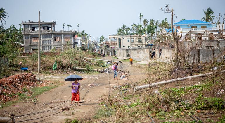 A displaced child prepares to dig a hole to set up a tent at an IDP site in Rakhine. (file)