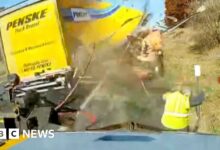 Watch: The moment a worker avoids a collision with a high-speed truck