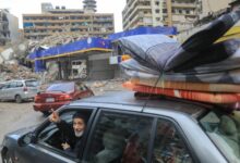 People return with their belongings to their homes in Beirut’s southern suburbs