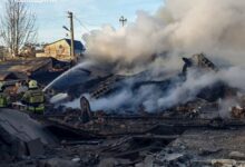 Firefighters douse a Lviv building hit by a Russian missile attack