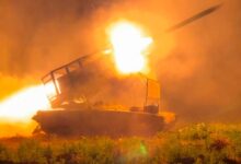 In this photo taken from a video released by Russian Defense Ministry press service on November 13, the Russian army’s multiple rocket launcher Solntsepyok fires towards Ukrainian positions in the border area of the Kursk region in Russia