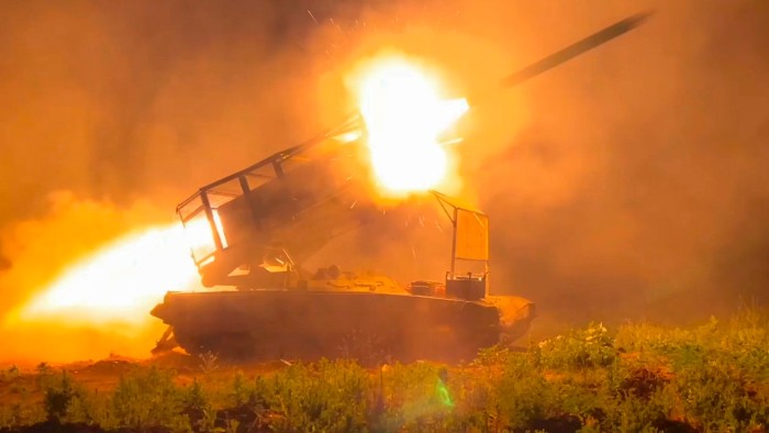 In this photo taken from a video released by Russian Defense Ministry press service on November 13, the Russian army’s multiple rocket launcher Solntsepyok fires towards Ukrainian positions in the border area of the Kursk region in Russia