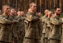 Newly recruited soldiers of Ukraine’s 3rd Assault Brigade line up at a military base close to Kyiv