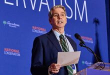 Scott Bessent speaks at a podium during the National Conservative Conference in Washington